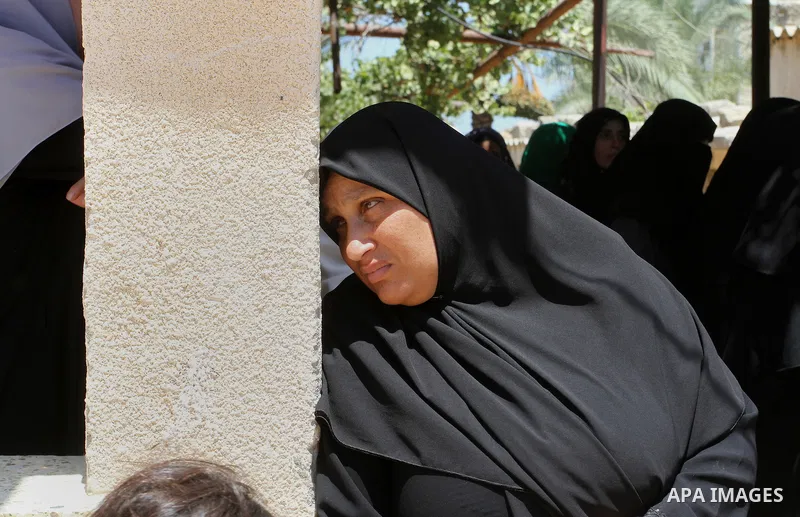 Palestinian relatives and friends mourn during the funeral of Salah al-Astal, a member of the Islamic Jihad's armed wing -the Al-Quds Brigades- who died after a tunnel collapse in the Gaza Strip, on July 19, 2016 in Khan...