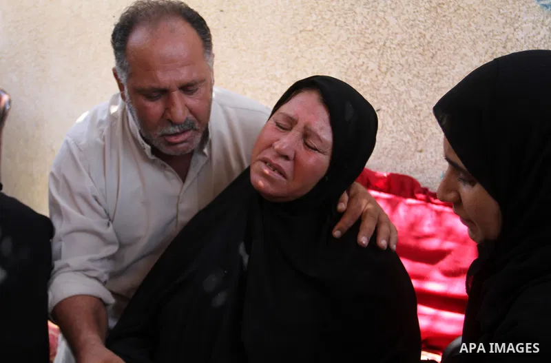 Palestinian relatives and friends mourn during the funeral of Salah al-Astal, a member of the Islamic Jihad's armed wing -the Al-Quds Brigades- who died after a tunnel collapse in the Gaza Strip, on July 19, 2016 in Khan...