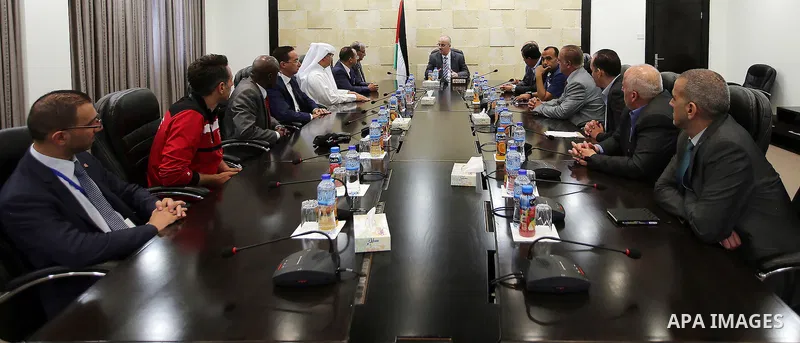 Palestinian Prime Minister, Rami Hamadallah, meets with a delegation from the Arab and international federations Taekwondo, in the West Bank city of Ramallah, on July 19, 2016. Photo by Prime Minister Office