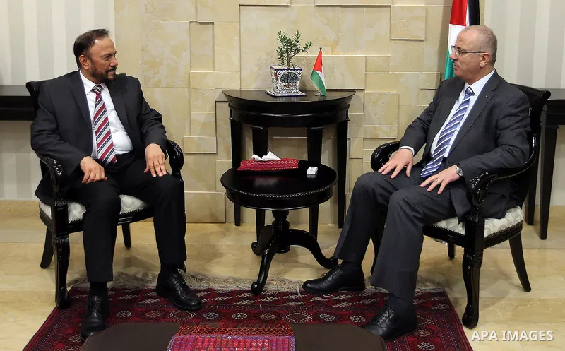 Palestinian Prime Minister, Rami Hamadallah, meets with Head of the Saudi Middle East Center for Political and Strategic Studies, Major General, Anwar Eshqi, in the West Bank city of Ramallah, on July 19, 2016. Photo by...