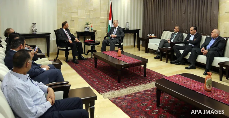 Palestinian Prime Minister, Rami Hamadallah, meets with Head of the Saudi Middle East Center for Political and Strategic Studies, Major General, Anwar Eshqi, in the West Bank city of Ramallah, on July 19, 2016. Photo by...