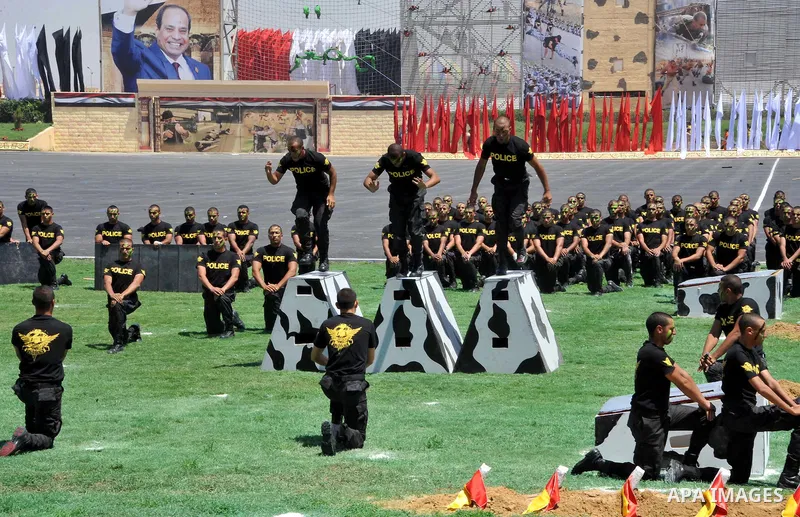 Egyptian police officers demonstrate their skills during at the police academy in Cairo, Egypt July 19, 2016. Photo by Egyptian President Office