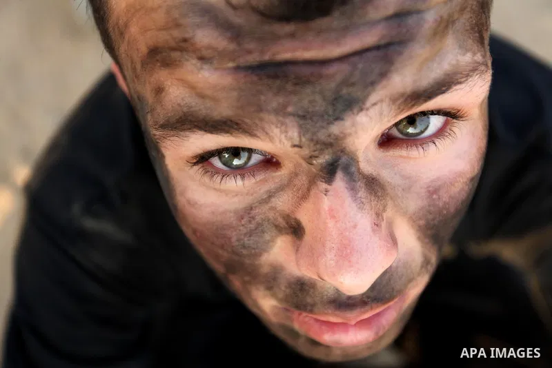 Palestinian youths take part in a military-style exercise at the Liberation Youths summer camp, organised by the Hamas movement, in Gaza city on July 20, 2016. Photo by Ashraf Amra
