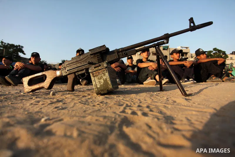 Palestinian youths take part in a military-style exercise at the Liberation Youths summer camp, organised by the Hamas movement, in Gaza city on July 20, 2016. Photo by Ashraf Amra