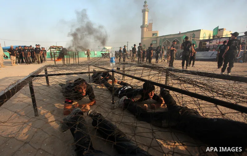 Palestinian youths demonstrate their skills during a military-style exercise at the Liberation Youths summer camp, organised by the Hamas movement, in Gaza city on July 20, 2016. Photo by Ashraf Amra