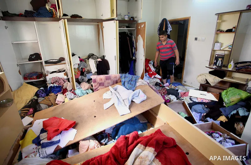 Palestinians inspect their room after the Israeli soldiers raided their family house, at Kafr Qalil village near the West Bank city of Nablus, on July 21, 2016. Photo by Nedal Eshtayah