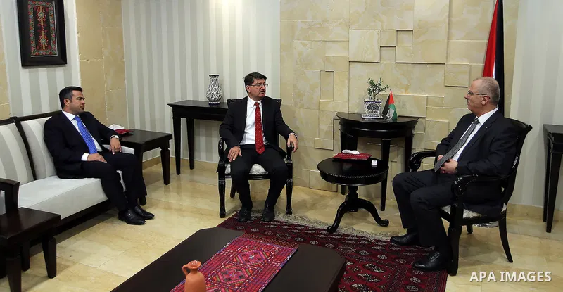 Palestinian Prime Minister, Rami Hamadallah, meets with Turkish Consul Mustafa Sarnbj, in the West Bank city of Ramallah, on July 21, 2016. Photo by Prime Minister Office