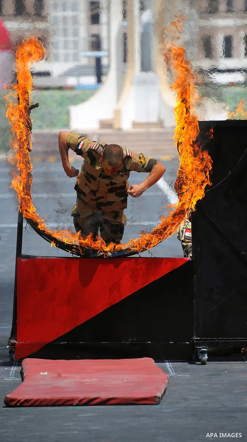 Egyptian forces demonstrate their skills during a military academy graduation ceremony in the capital, Cairo, on July 21, 2016. Photo by Egyptian President Office