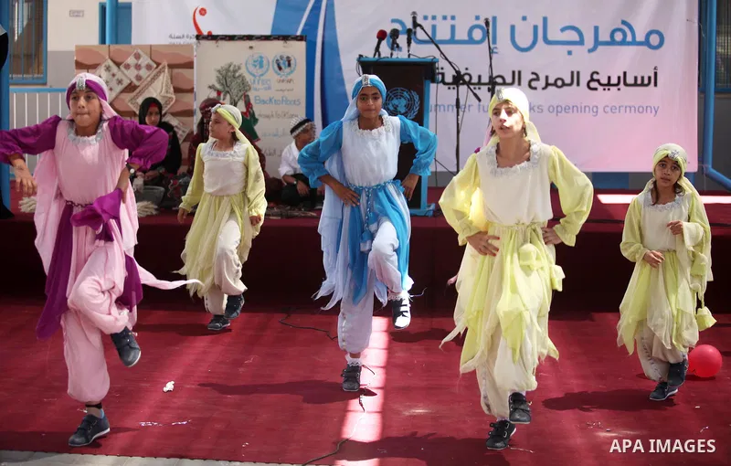 Palestinian youth enjoy as part of the activities proposed during a summer camp organised by the United Nations on July 23, 2016 in Gaza City. Photo by Ashraf Amra