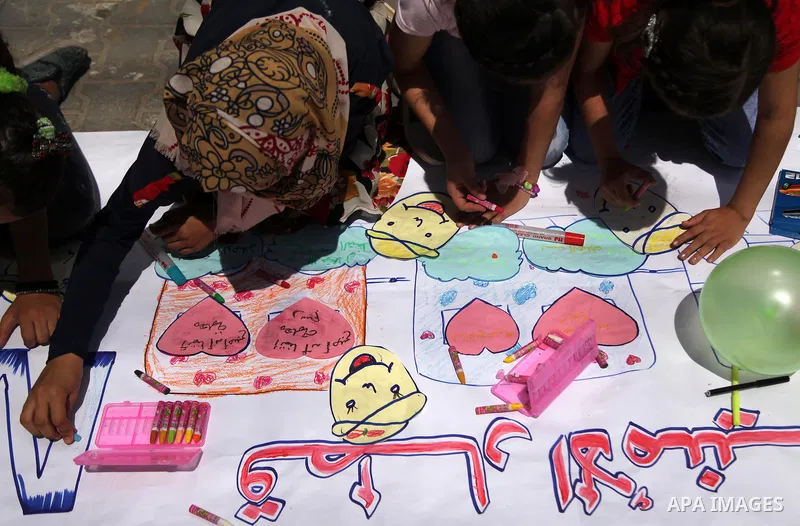 Palestinian youth enjoy as part of the activities proposed during a summer camp organised by the United Nations on July 23, 2016 in Gaza City. Photo by Ashraf Amra