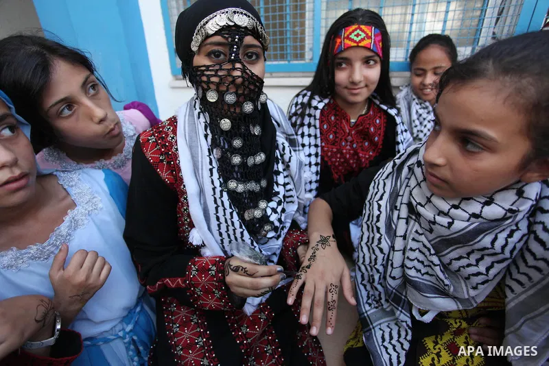 Palestinian youth enjoy as part of the activities proposed during a summer camp organised by the United Nations on July 23, 2016 in Gaza City. Photo by Ashraf Amra
