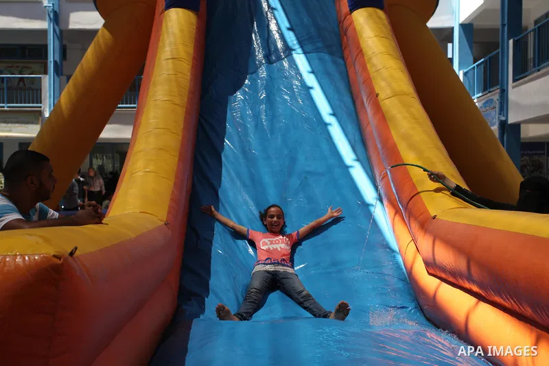 Palestinian youth enjoy as part of the activities proposed during a summer camp organised by the United Nations on July 23, 2016 in Gaza City. Photo by Ashraf Amra