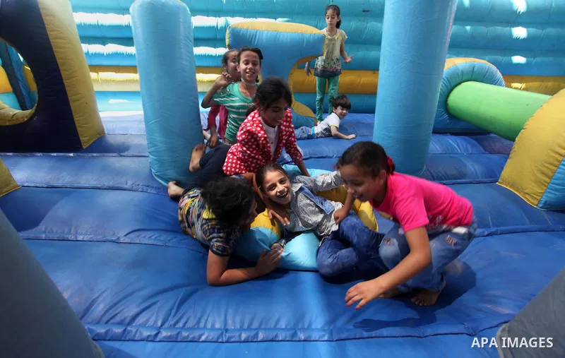 Palestinian youth enjoy as part of the activities proposed during a summer camp organised by the United Nations on July 23, 2016 in Gaza City. Photo by Ashraf Amra
