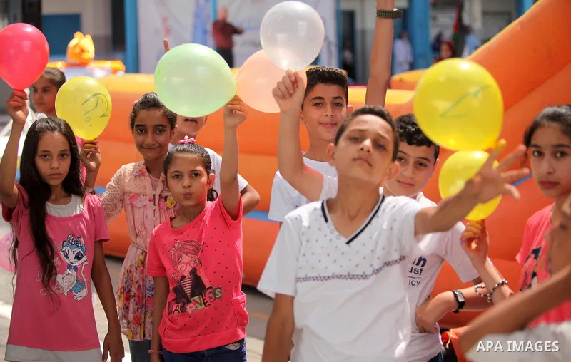 Palestinian youth enjoy as part of the activities proposed during a summer camp organised by the United Nations on July 23, 2016 in Gaza City. Photo by Ashraf Amra