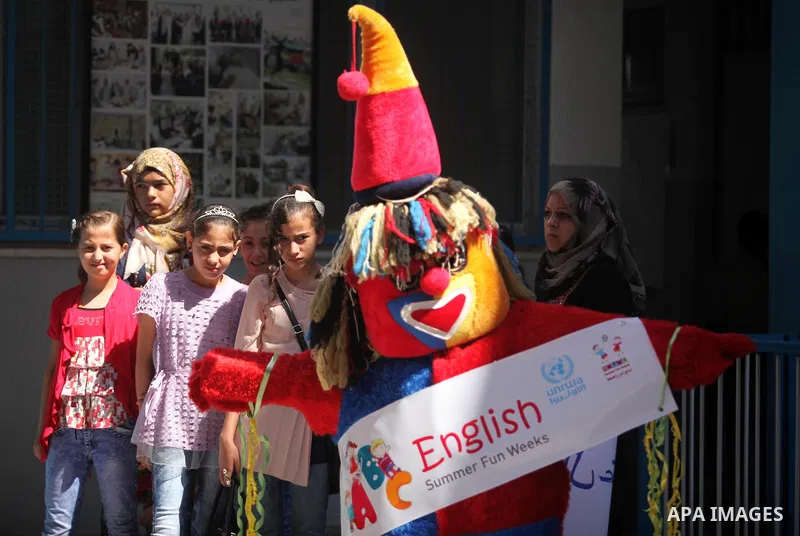 Palestinian youth enjoy as part of the activities proposed during a summer camp organised by the United Nations on July 23, 2016 in Gaza City. Photo by Ashraf Amra