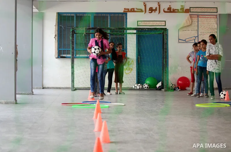 Palestinian youth enjoy as part of the activities proposed during a summer camp organised by the United Nations on July 23, 2016 in Gaza City. Photo by Ashraf Amra