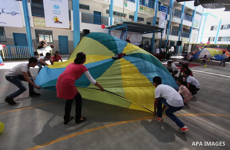 Palestinian youth enjoy as part of the activities proposed during a summer camp organised by the United Nations on July 23, 2016 in Gaza City. Photo by Ashraf Amra