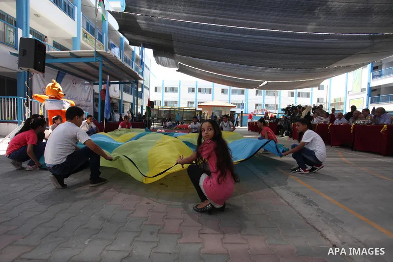 Palestinian youth enjoy as part of the activities proposed during a summer camp organised by the United Nations on July 23, 2016 in Gaza City. Photo by Ashraf Amra