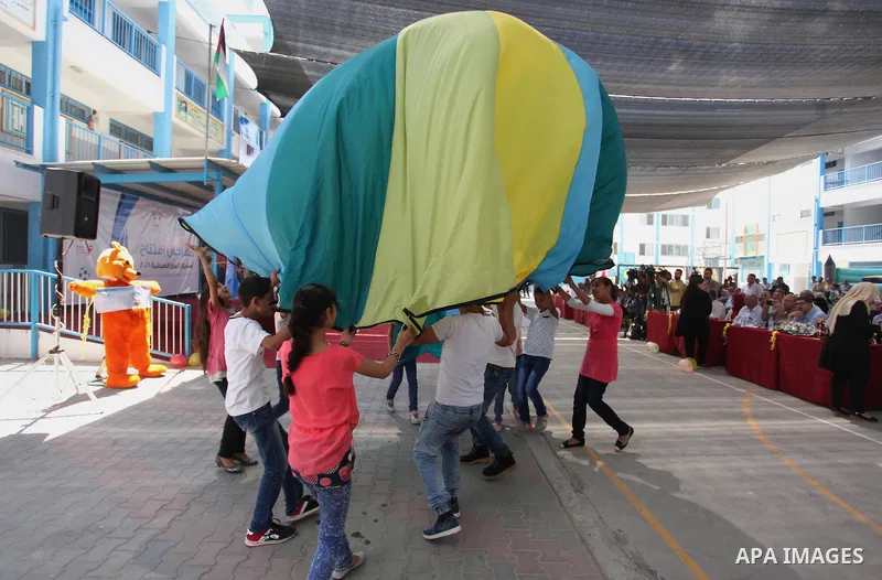 Palestinian youth enjoy as part of the activities proposed during a summer camp organised by the United Nations on July 23, 2016 in Gaza City. Photo by Ashraf Amra