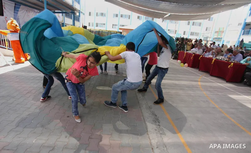 Palestinian youth enjoy as part of the activities proposed during a summer camp organised by the United Nations on July 23, 2016 in Gaza City. Photo by Ashraf Amra