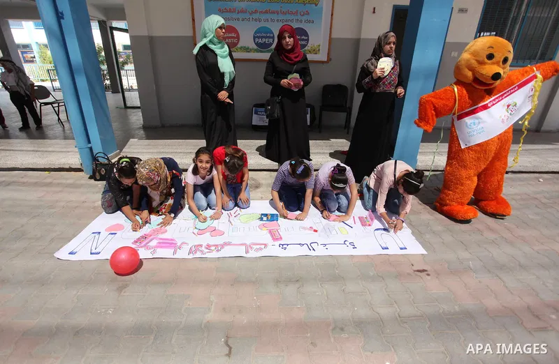 Palestinian youth enjoy as part of the activities proposed during a summer camp organised by the United Nations on July 23, 2016 in Gaza City. Photo by Ashraf Amra