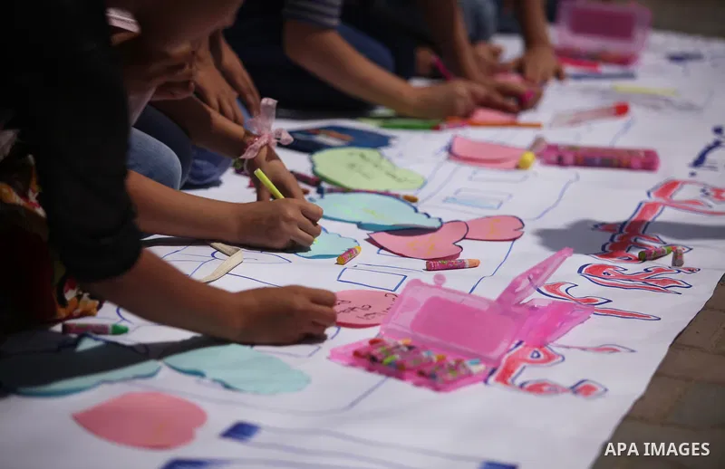 Palestinian youth enjoy as part of the activities proposed during a summer camp organised by the United Nations on July 23, 2016 in Gaza City. Photo by Ashraf Amra