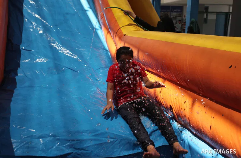 Palestinian youth enjoy as part of the activities proposed during a summer camp organised by the United Nations on July 23, 2016 in Gaza City. Photo by Ashraf Amra