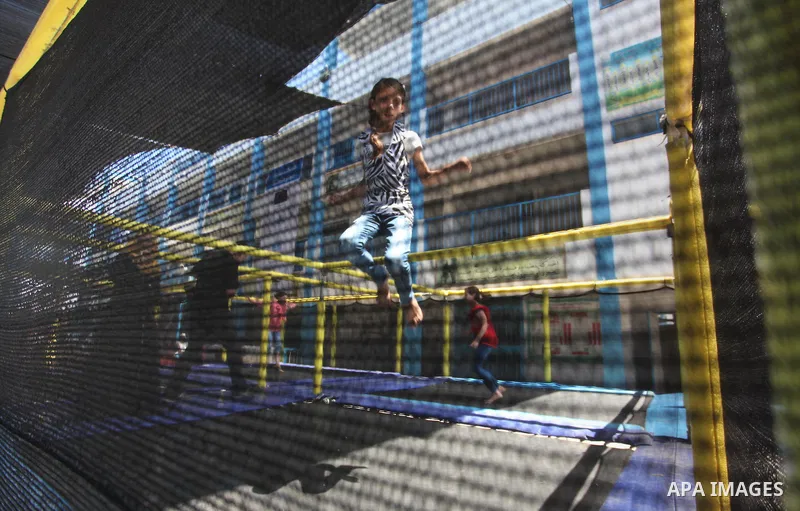 Palestinian youth enjoy as part of the activities proposed during a summer camp organised by the United Nations on July 23, 2016 in Gaza City. Photo by Ashraf Amra