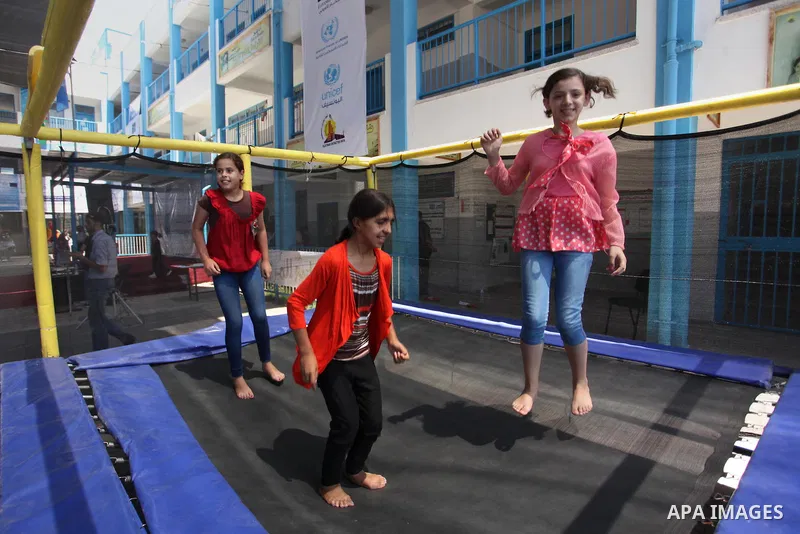 Palestinian youth enjoy as part of the activities proposed during a summer camp organised by the United Nations on July 23, 2016 in Gaza City. Photo by Ashraf Amra