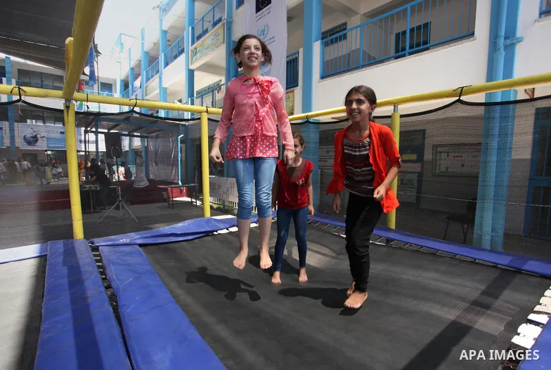Palestinian youth enjoy as part of the activities proposed during a summer camp organised by the United Nations on July 23, 2016 in Gaza City. Photo by Ashraf Amra