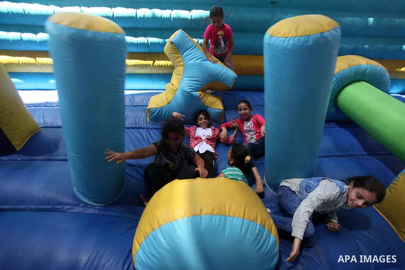 Palestinian youth enjoy as part of the activities proposed during a summer camp organised by the United Nations on July 23, 2016 in Gaza City. Photo by Ashraf Amra