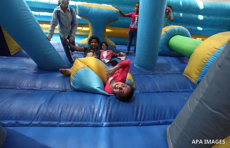 Palestinian youth enjoy as part of the activities proposed during a summer camp organised by the United Nations on July 23, 2016 in Gaza City. Photo by Ashraf Amra