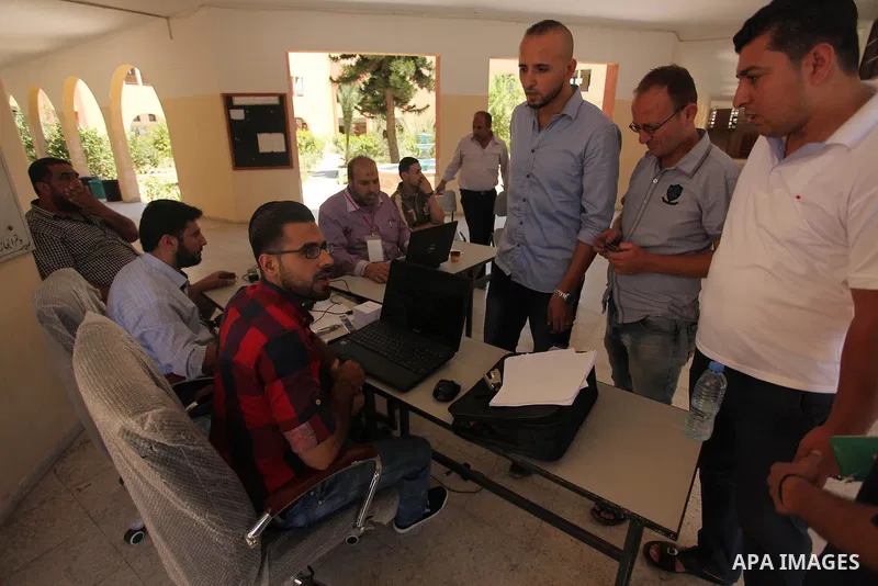 Palestinians wait to register their names at Voter registration centers in Gaza city, on July 23, 2016. The Palestinian Central Elections Commission (CEO) announced Saturday that voter registration centers would be open...