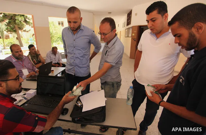 Palestinians wait to register their names at Voter registration centers in Gaza city, on July 23, 2016. The Palestinian Central Elections Commission (CEO) announced Saturday that voter registration centers would be open...