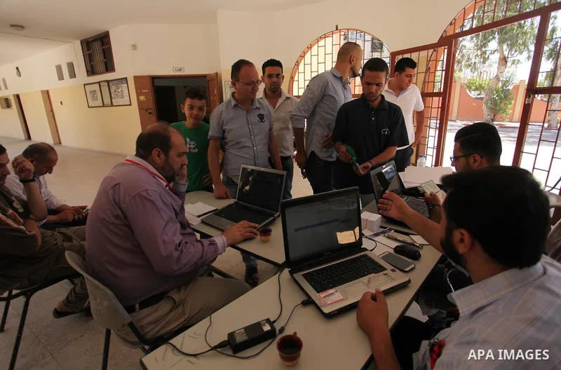 Palestinians wait to register their names at Voter registration centers in Gaza city, on July 23, 2016. The Palestinian Central Elections Commission (CEO) announced Saturday that voter registration centers would be open...
