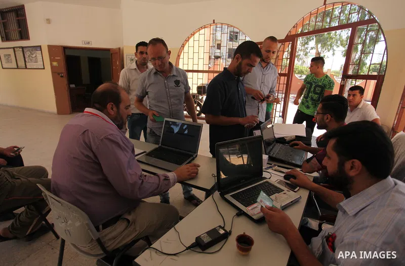 Palestinians wait to register their names at Voter registration centers in Gaza city, on July 23, 2016. The Palestinian Central Elections Commission (CEO) announced Saturday that voter registration centers would be open...
