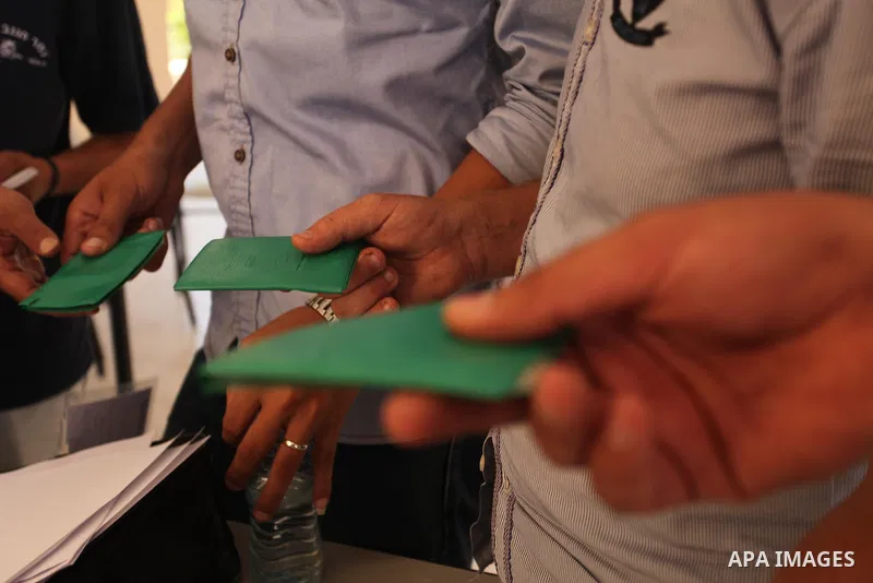 Palestinians wait to register their names at Voter registration centers in Gaza city, on July 23, 2016. The Palestinian Central Elections Commission (CEO) announced Saturday that voter registration centers would be open...