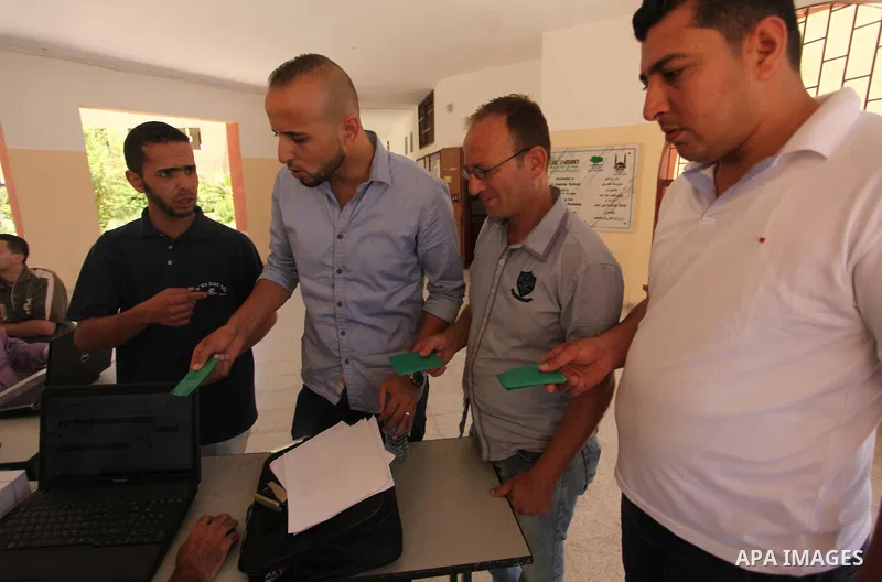 Palestinians wait to register their names at Voter registration centers in Gaza city, on July 23, 2016. The Palestinian Central Elections Commission (CEO) announced Saturday that voter registration centers would be open...