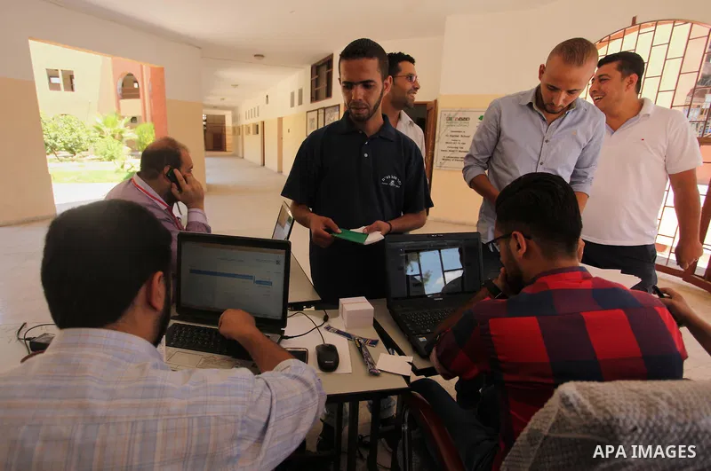 Palestinians wait to register their names at Voter registration centers in Gaza city, on July 23, 2016. The Palestinian Central Elections Commission (CEO) announced Saturday that voter registration centers would be open...