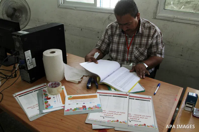 Palestinians from Central Elections Commission (CEO) work at Voter registration centers in Rafah in the southern Gaza strip on July 23, 2016. The Palestinian Central Elections Commission (CEO) announced Saturday that vot...