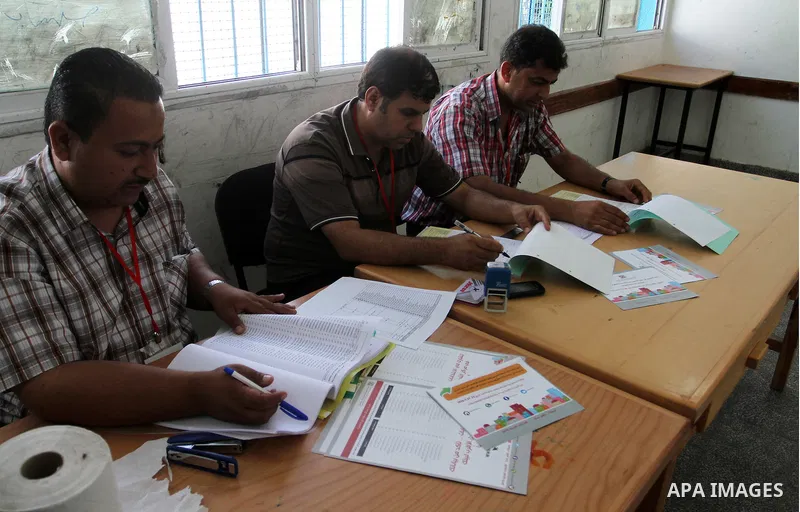 Palestinians from Central Elections Commission (CEO) work at Voter registration centers in Rafah in the southern Gaza strip on July 23, 2016. The Palestinian Central Elections Commission (CEO) announced Saturday that vot...
