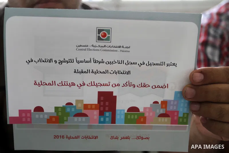 Palestinians from Central Elections Commission (CEO) work at Voter registration centers in Rafah in the southern Gaza strip on July 23, 2016. The Palestinian Central Elections Commission (CEO) announced Saturday that vot...