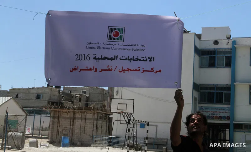 Palestinians from Central Elections Commission (CEO) work at Voter registration centers in Rafah in the southern Gaza strip on July 23, 2016. The Palestinian Central Elections Commission (CEO) announced Saturday that vot...