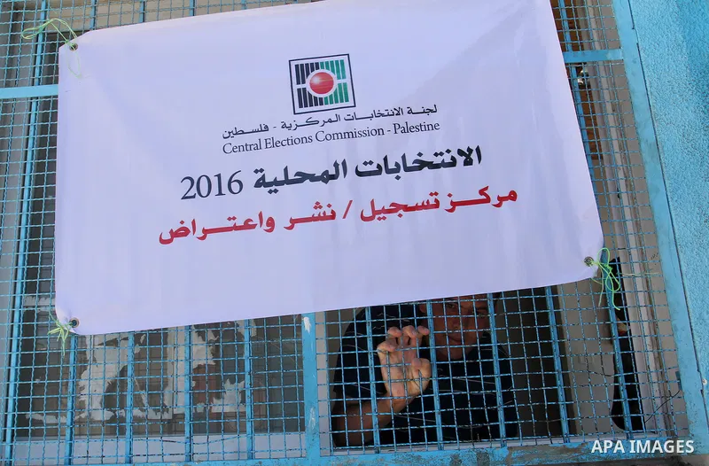 Palestinians from Central Elections Commission (CEO) work at Voter registration centers in Rafah in the southern Gaza strip on July 23, 2016. The Palestinian Central Elections Commission (CEO) announced Saturday that vot...