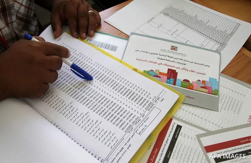 Palestinians from Central Elections Commission (CEO) work at Voter registration centers in Rafah in the southern Gaza strip on July 23, 2016. The Palestinian Central Elections Commission (CEO) announced Saturday that vot...