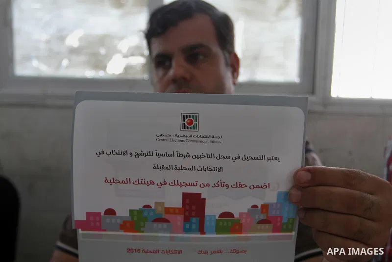 Palestinians from Central Elections Commission (CEO) work at Voter registration centers in Rafah in the southern Gaza strip on July 23, 2016. The Palestinian Central Elections Commission (CEO) announced Saturday that vot...