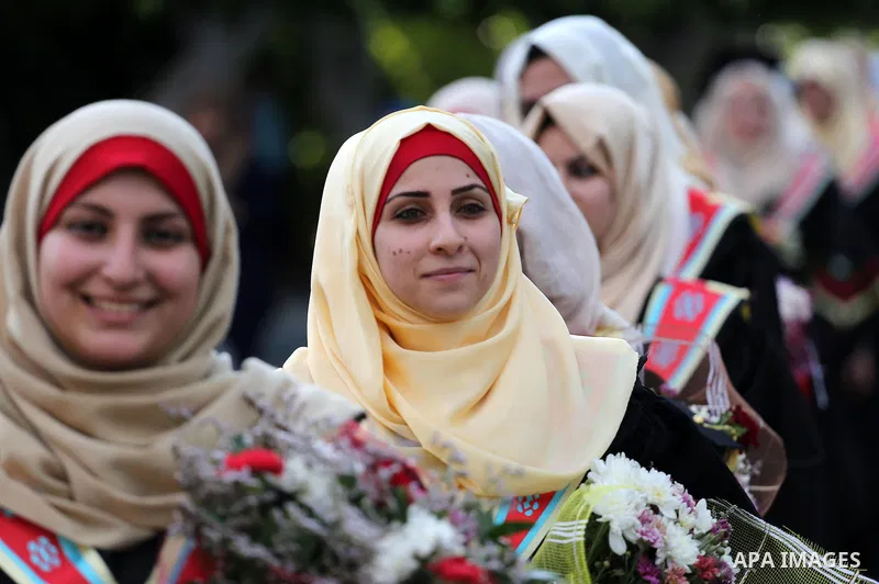 Palestinian students participate in their graduation ceremony at the Islamic University in Gaza city on July 23, 2016. Photo by Mohammed Asad