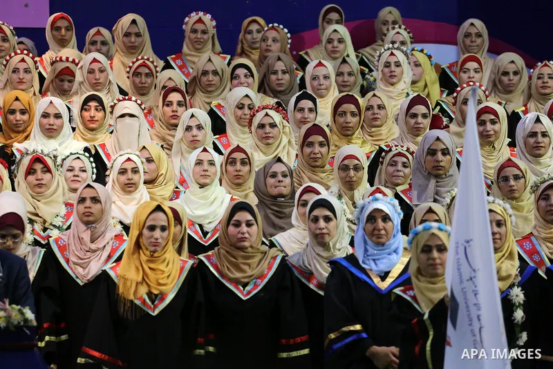 Palestinian students participate in their graduation ceremony at the Islamic University in Gaza city on July 23, 2016. Photo by Mohammed Asad