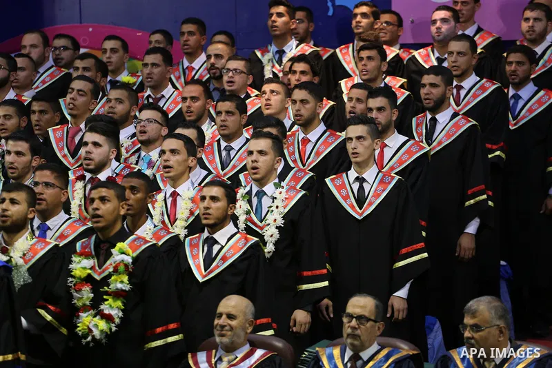 Palestinian students participate in their graduation ceremony at the Islamic University in Gaza city on July 23, 2016. Photo by Mohammed Asad
