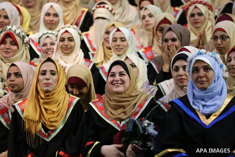 Palestinian students participate in their graduation ceremony at the Islamic University in Gaza city on July 23, 2016. Photo by Mohammed Asad